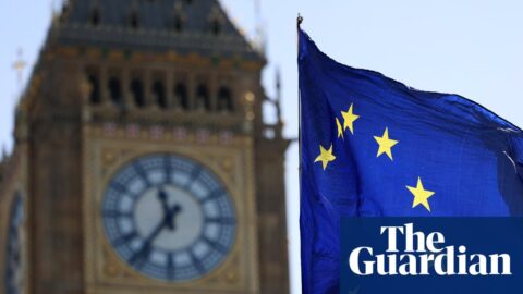 An EU flag flies in the wind outside Big Ben in London