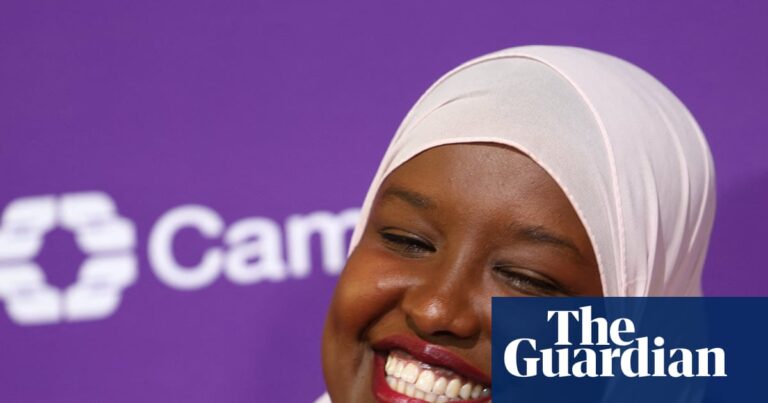 Sagal Abdi-Wali smiles in a pink hijab and blazer after her by-election win