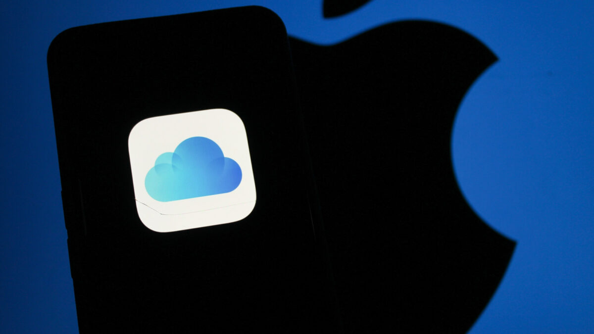 An iCloud logo is visible on a handheld iPhone